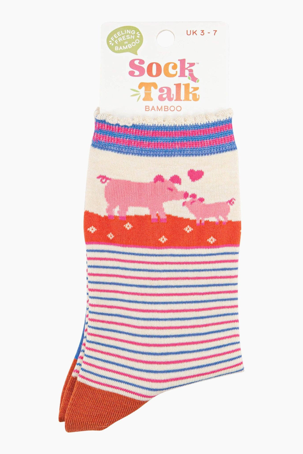Foldede strømper med Sock Talk-logo og grisemotiv, pakket klar til gave